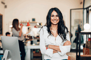 Entrepreneur standing confidently in an office, showcasing growth achieved through the PowerScan strategy.